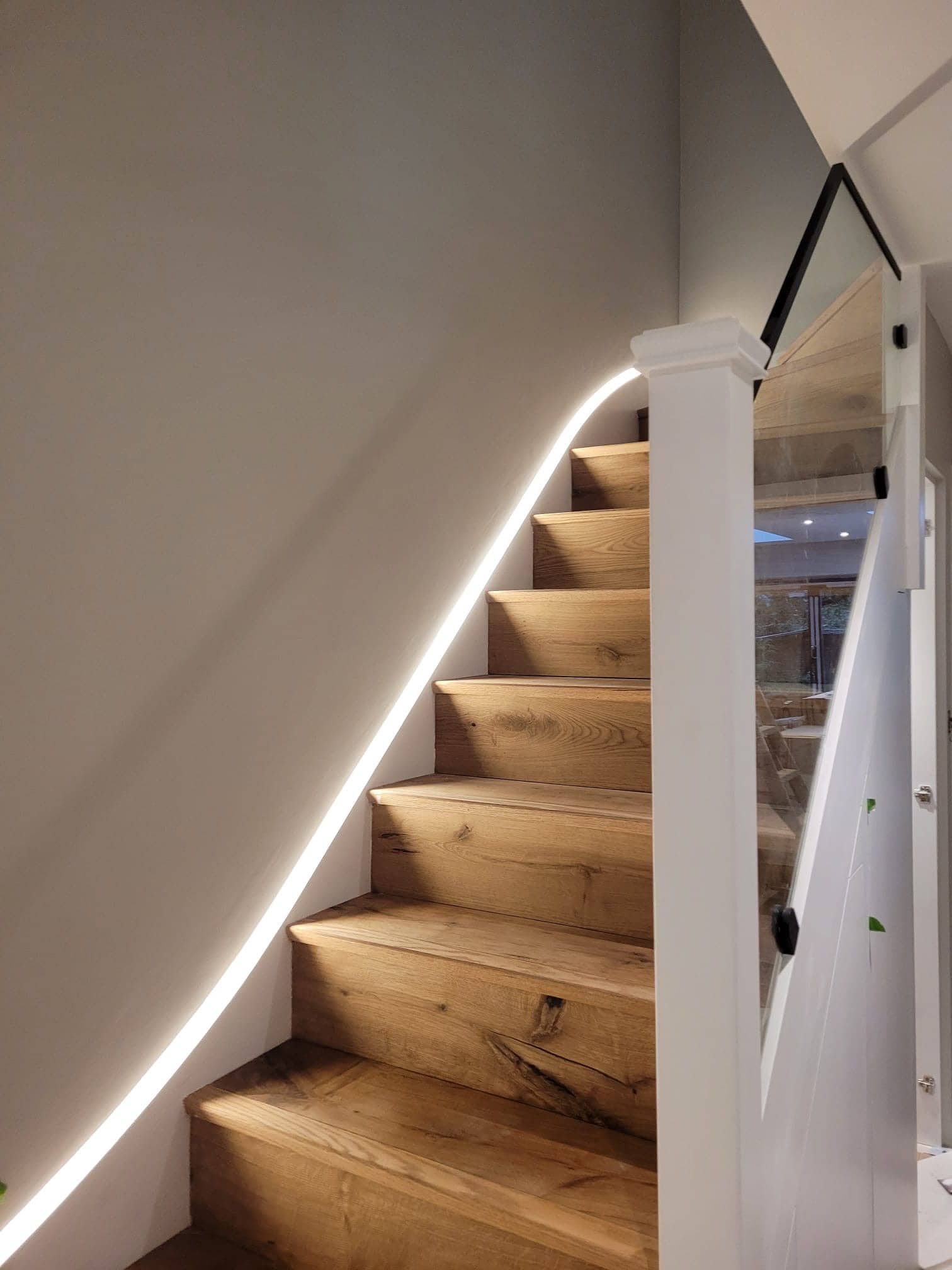 Luxury marble bathroom renovation with brass fixtures and LED lighting