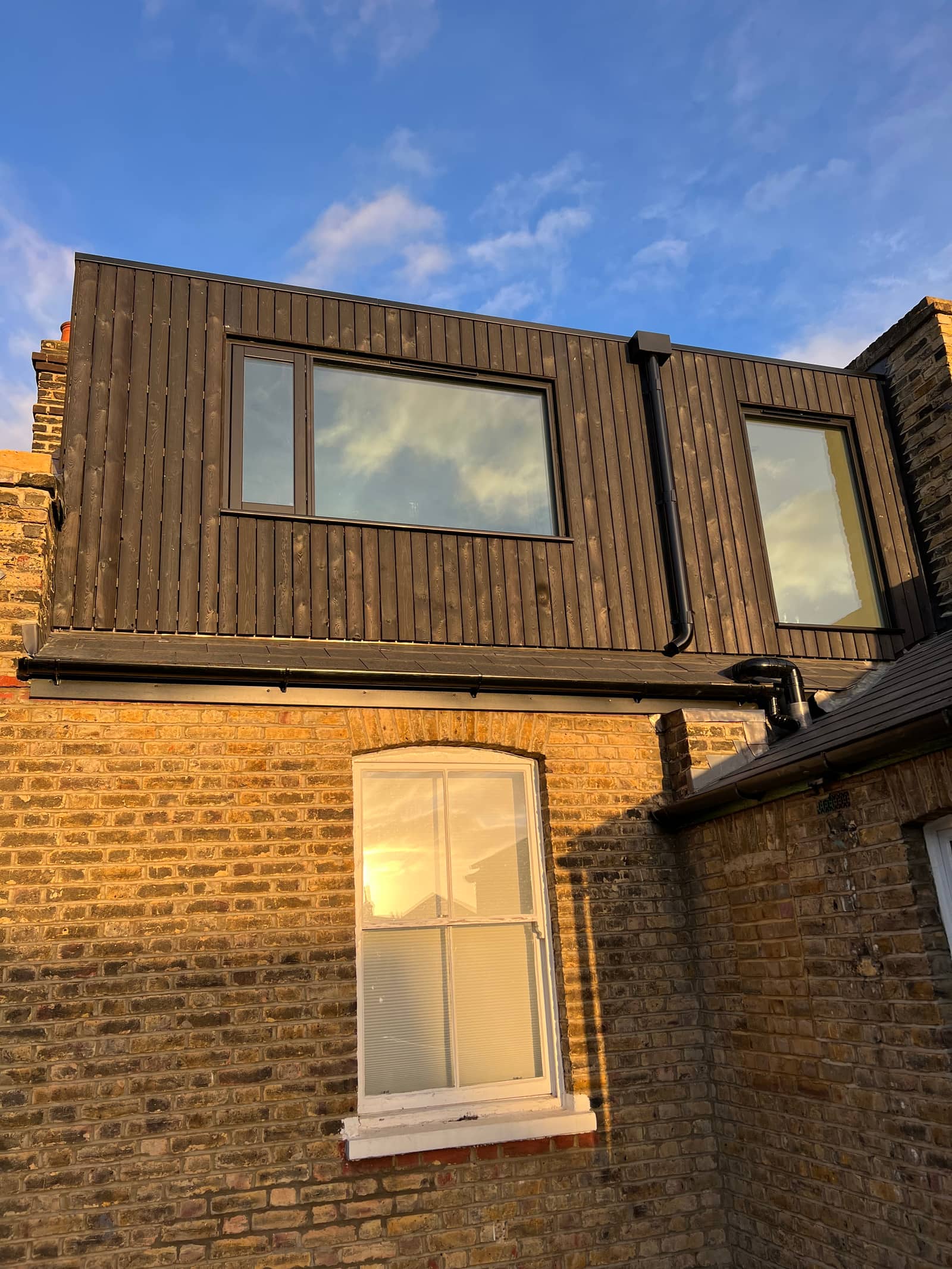 Loft Burned Cladding 1600 - Loft conversion project by SpaceRise Lofts